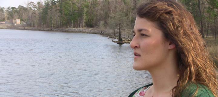 photo of woman by a river