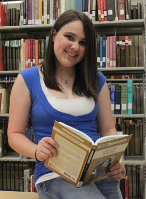 Christine Zabala with book in library