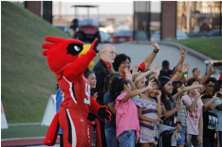 The Cardinal NEST campuses, Pietzsch-MacArthur, Blanchette Elementary, and Charlton-Pollard Elementary Scholars' Mathletes and Reading Millionaires are recognized by Big Red at Lamar University to all of cardinal nation at the football season opener. President Ken Evans and SOAR members join BISD Scholars to celebrate their major accomplishments.