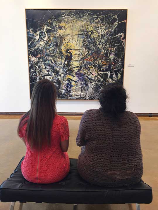 Dishman Art Museum -visitors admiring painting