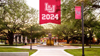 An image of the Quad at LU with the Mirabeau head statue in the middle. At the top, there is a banner with the LU logo and 2024 below it