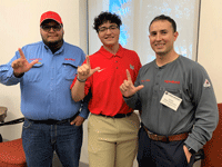 LU Graduates who are ExxonMobil employees pose with LU student
