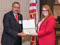 Hyattye Simmons received Legacy Society Certificate from Ambassador Kayla Clifton