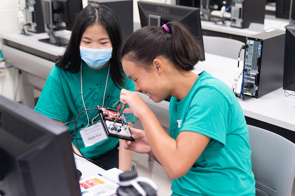 2 girls working on circuit board, Digital Dreamers Coding Camp 2021