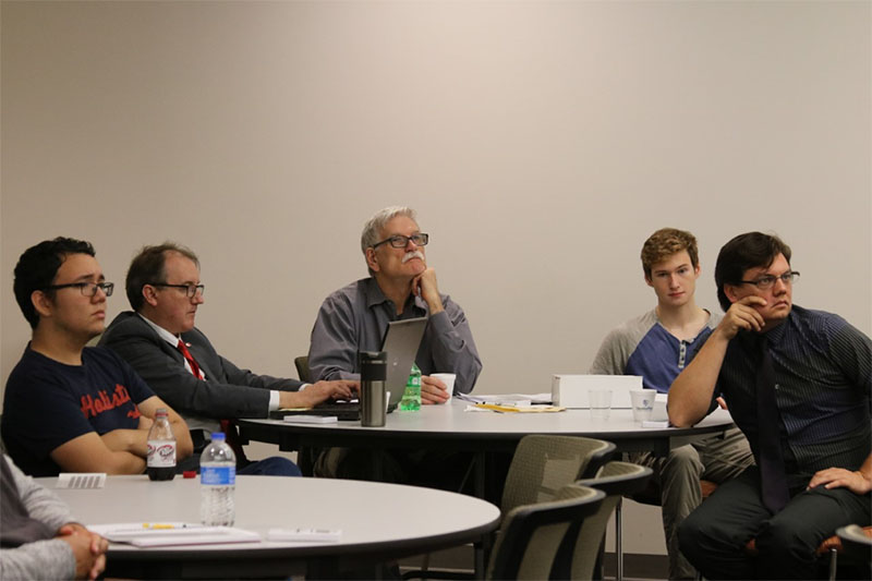 Participants at the conference listen to presentations