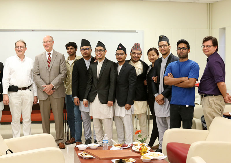 Attendees at the food festival include Dr. Stefan Andrei and Lamar president Ken Evans