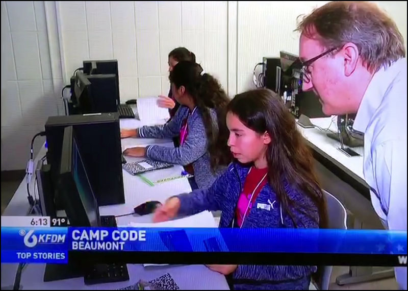 Dr. Stefan Andrei helps a student write a computer program.