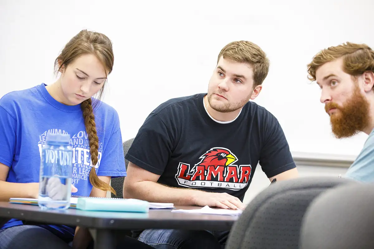 Students take notes in a classroom