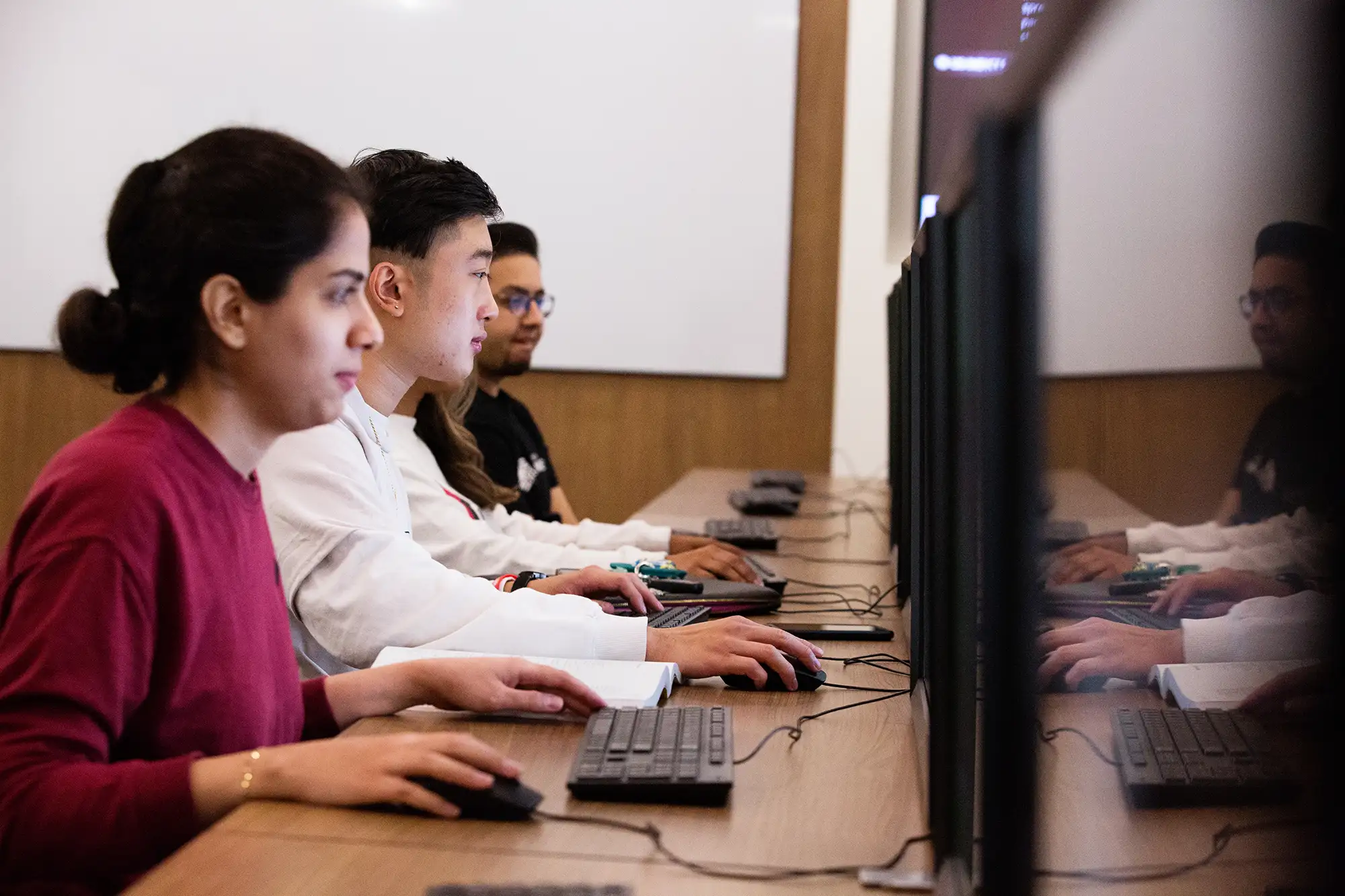 business-student-working-at-computer.webp