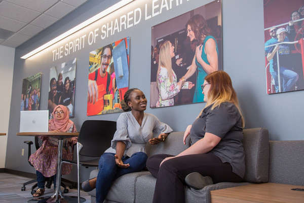 Students conversing in the student success lounge