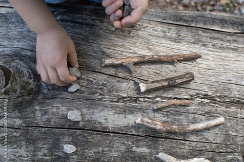 Child organizing stones