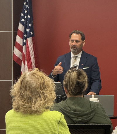 Welcome Week, provost welch standing behind podium speaking to students