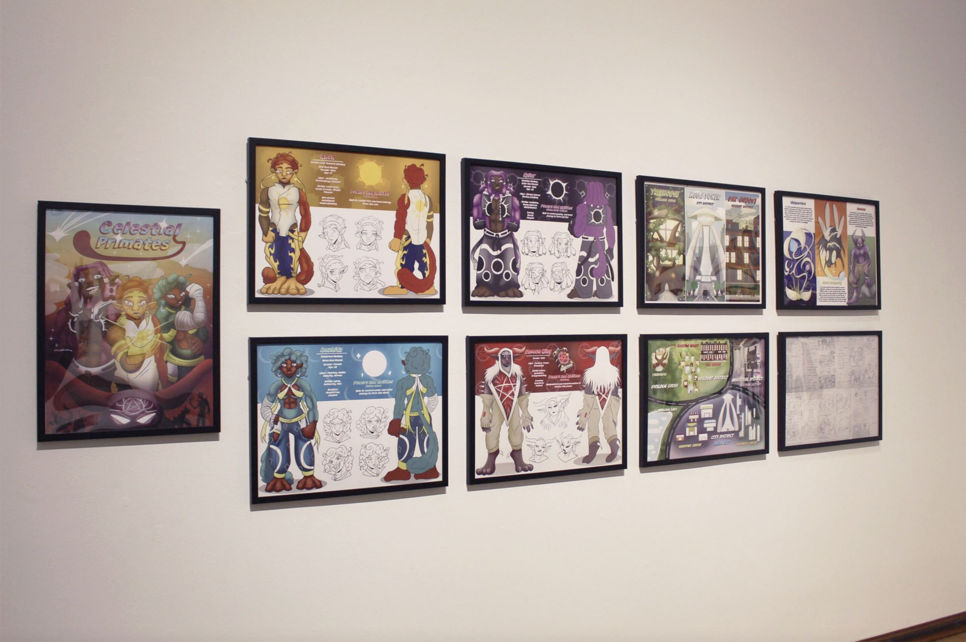 A gallery wall with nine framed character illustrations titled "Celestial Primates."
