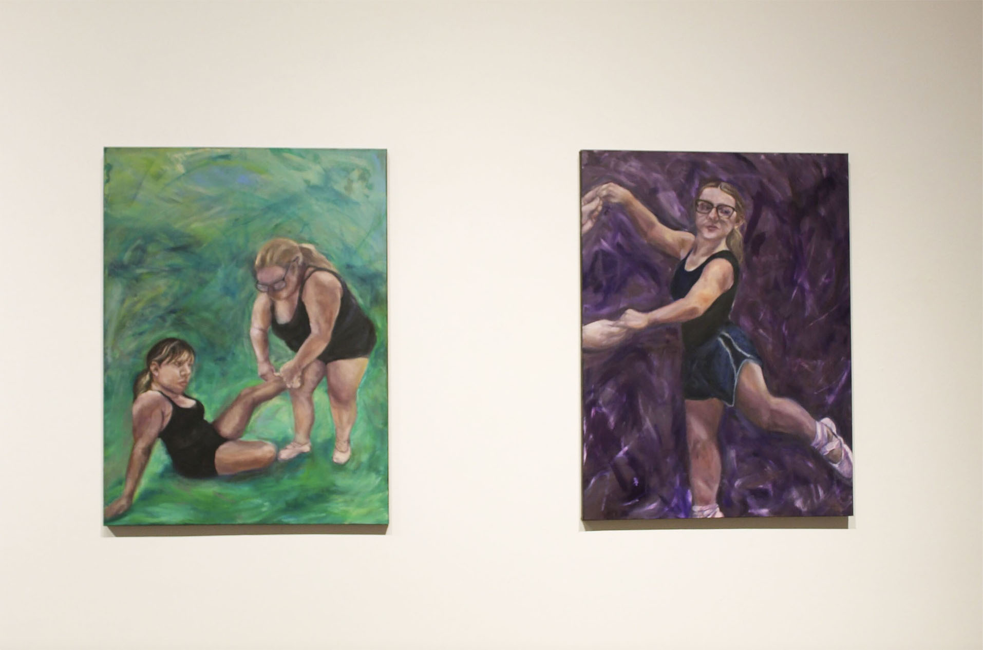 Two paintings: one shows two women, one seated and one standing, with a green background; the other depicts a woman dancing against a purple backdrop.