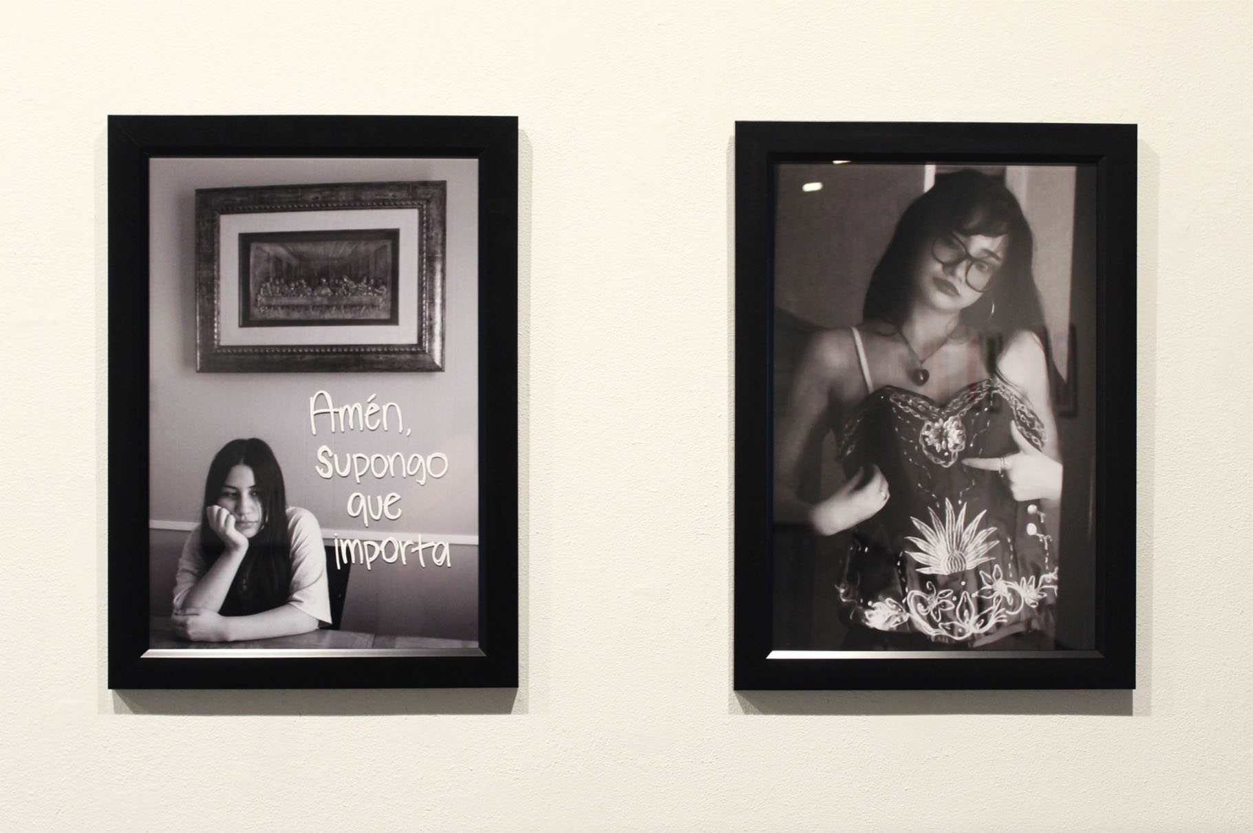 Two framed black-and-white portraits of young women.