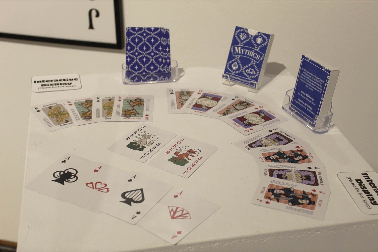 A display of custom playing cards featuring mythology themes.