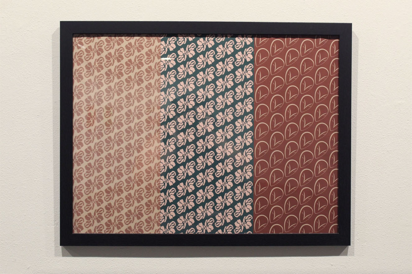 Framed artwork with three panels: beige floral, teal floral, and red leaf patterns.