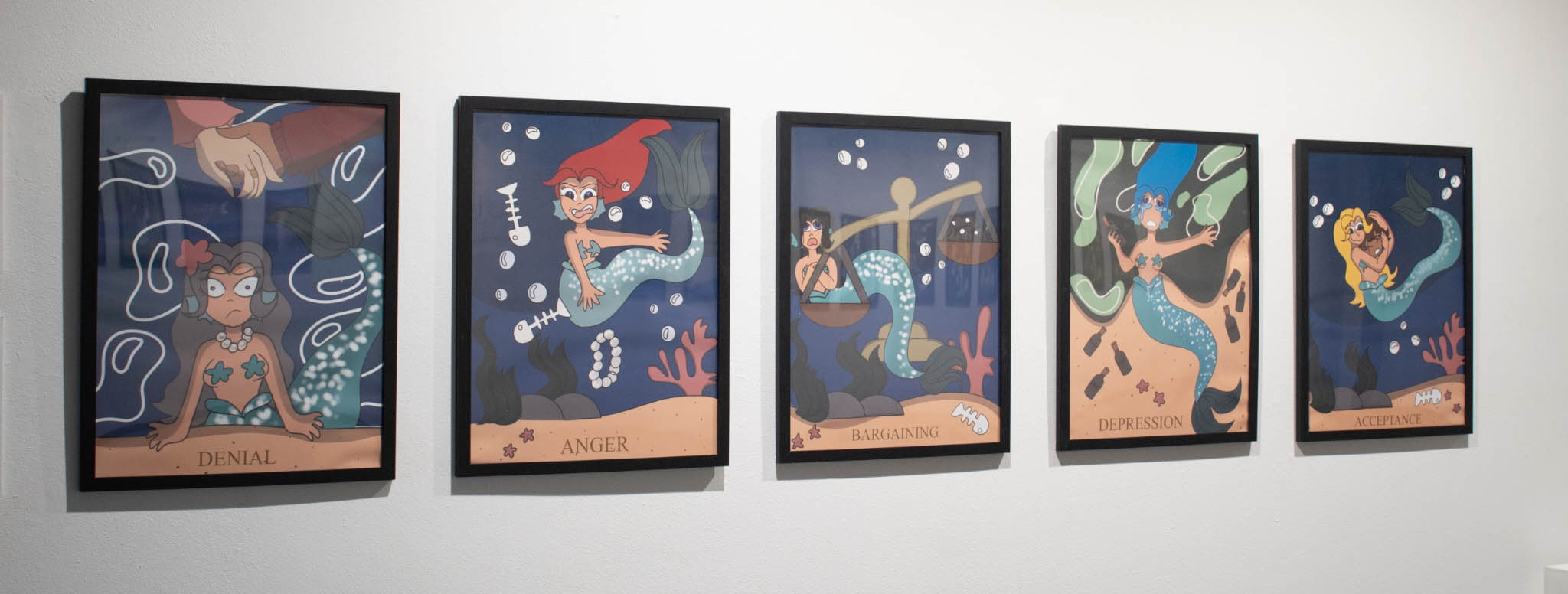 Five framed illustrations depicting mermaids representing denial, anger, bargaining, depression, and acceptance.