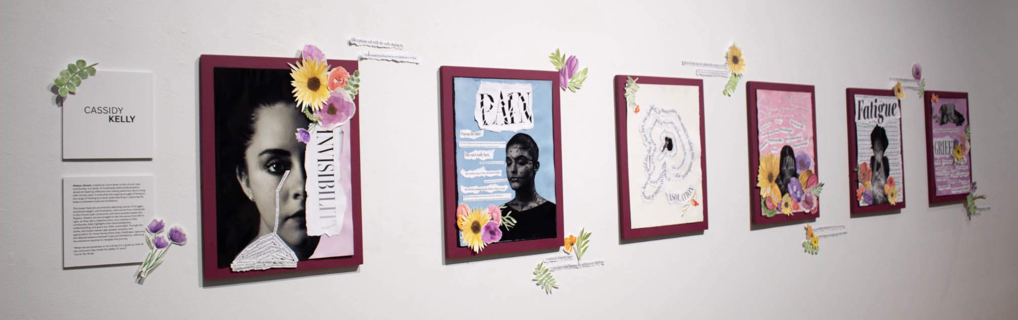 Art installation with six framed artworks featuring themes like "INVISIBILITY" and "GRIEF," decorated with flowers.