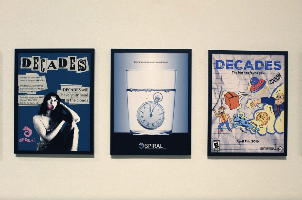 Three framed posters with distinct styles: a vintage bubblegum ad, a stopwatch in water, and a colorful cartoon scene.
