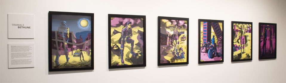 Art exhibition display of six colorful framed paintings by Tramale Bethune with two wall-mounted plaques.