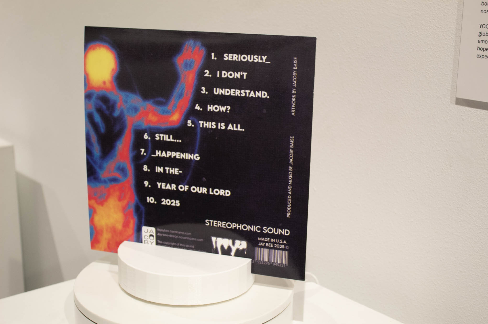Album cover displaying a thermal image of a human shape with text list on the side.