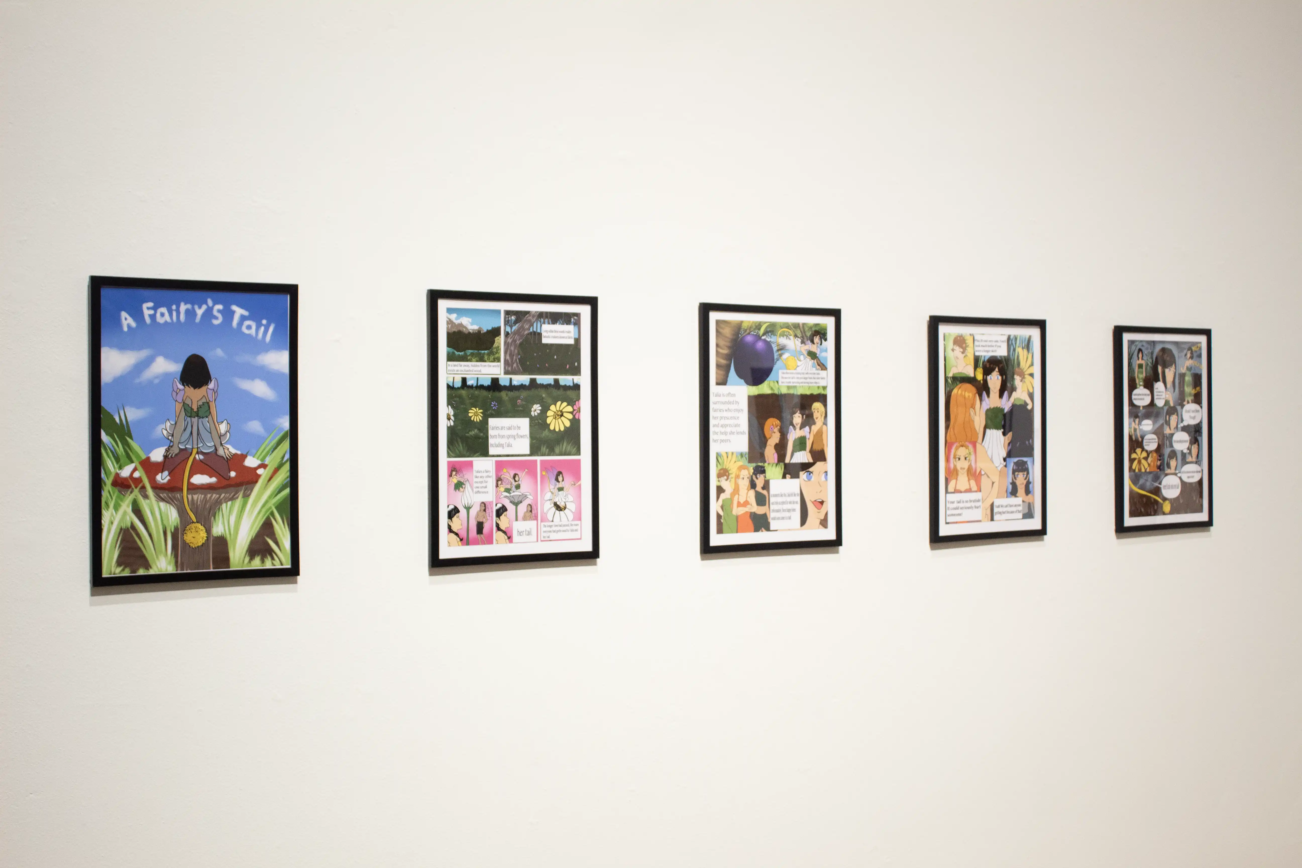 image of 5 framed colorful graphic novel images hanging on wall-A Fairy's Tale exhibition
