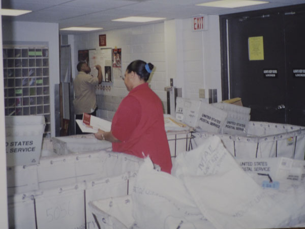 Cynthia Perkins sorting mail