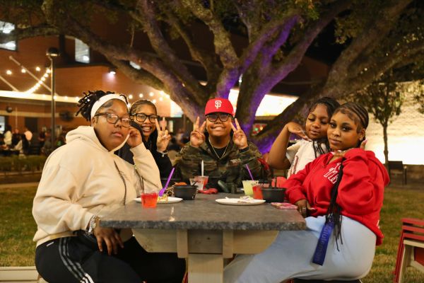 Students Eating at Mardi Gras Event 