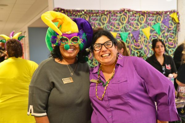 Dr. De La Rosa and Nicole Kyles-Burton at Mardi Gras Event 
