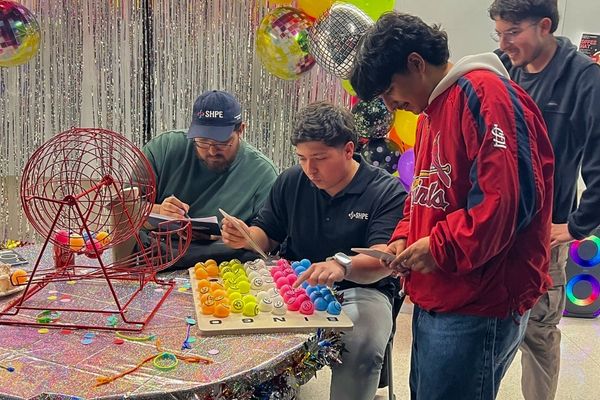 Students Gathered together playing bingo