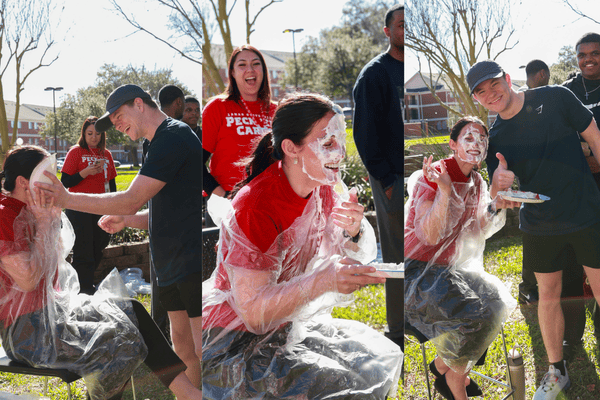 Student Pieing a professor at E Week event 