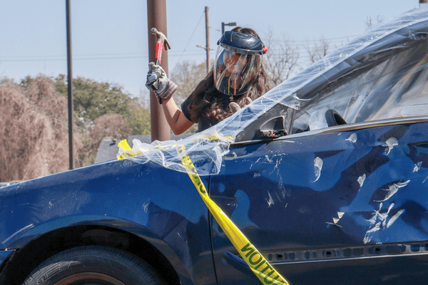 E Week Student Participating in Car Smash