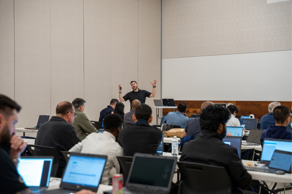 Man presents cybersecurity training to large crowd 