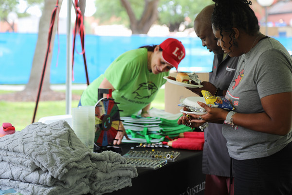 LU Sustainability Committee giving out swag at Earth Day