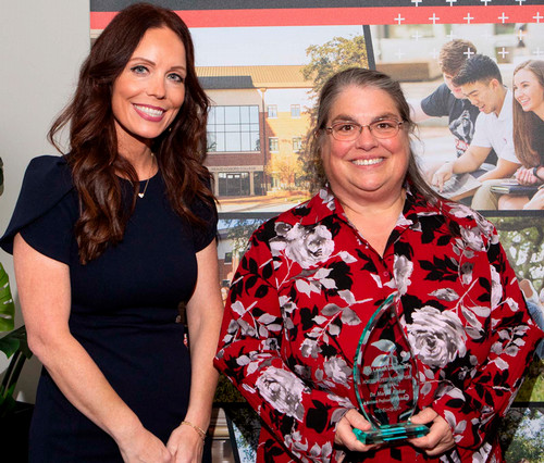 Dr. Rinker receives award from Dean Thibodeaux 