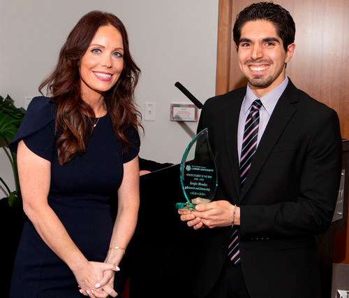 Sergio Mendez receives award from Dean Thibodeaux 