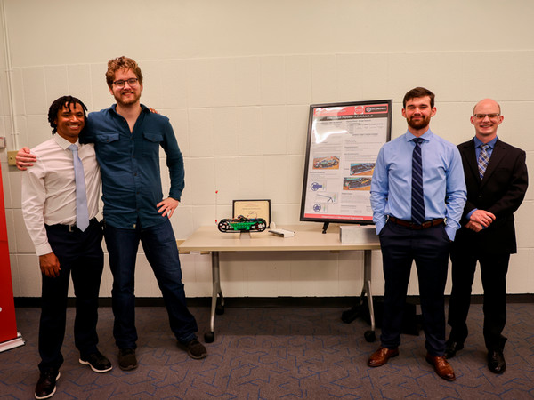 Brandyn New with group members at Engineering Senior Symposium