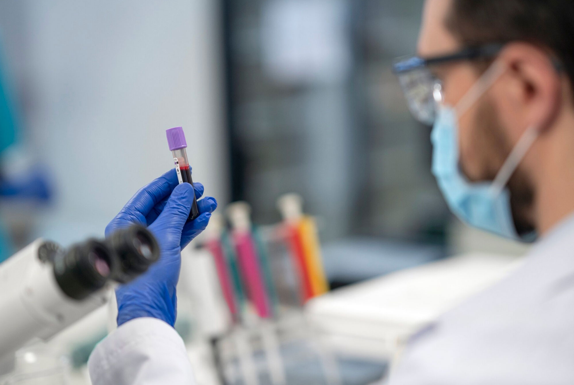 lab tech holding blood sample