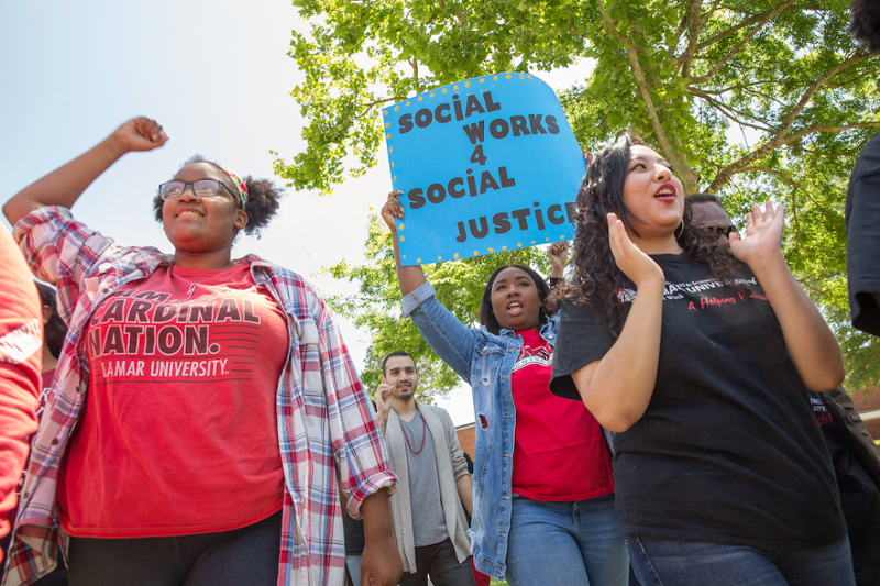 Social Work Students with Sign