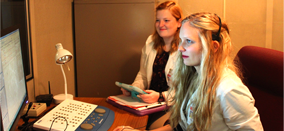 Tiffany Ballard and Katie Luttman testing a patient.