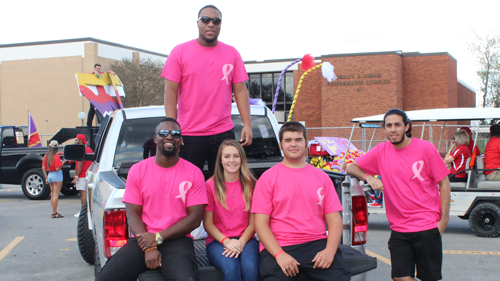 members of a student organization attending the homecoming parade