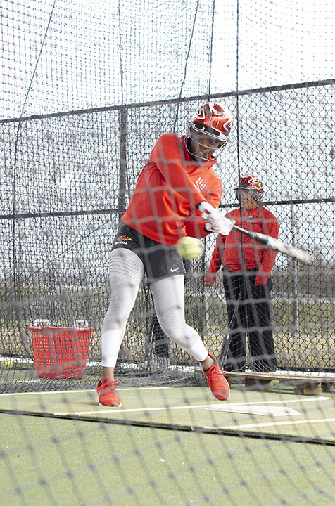 Utility player, Kimberly Mattox, practices hitting inside the batting cage during practice at the LU Softball Complex, Jan. 30. UP photo by Cassandra Jenkins