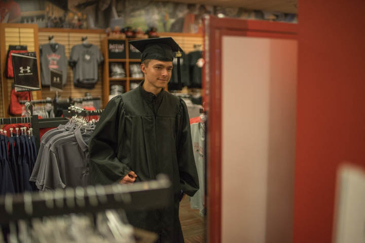 Eric Mittal, San Antonio senior, tries on his cap and gown in the Barnes & Noble book store inside the Setzer Student Center, Feb. 26. Mittal is getting ready for the Grad Fair which will take place in the SSC Live Oak Ballroom, 2-4 p.m., March 6. Students can apply for graduation, order caps and gowns, and speak with representatives about spring commencement.