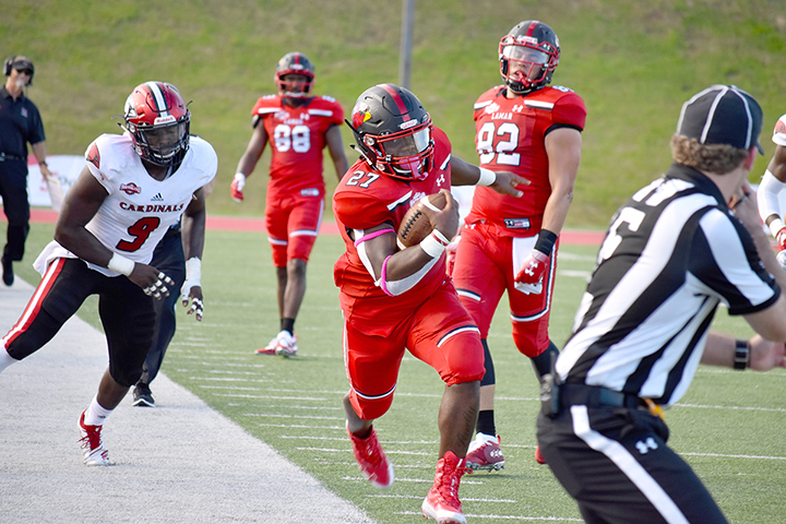 This is one of the photos that were featured in Smith's story, "Blocked". LU’s A.J. Walker, 27, below, runs the ball for a first down during Lamar’s 27-21 win over UIW at Provost Umphrey Stadium, Saturday. UP photo by Abigail Pennington