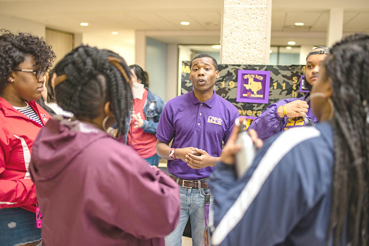 Caleb Love, Lamar junior, speaks at his Omega Psi Phi booth in the Setzer Student Center at Cardinal View, March 2. Below, shows the capacity of the atrium filled with students in the Setzer Student Center. More than 320 students participated. UP photo by Noah Dawlearn