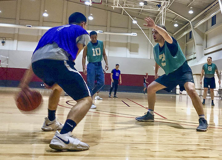 Intramural basketball men's team “Fat Filet,” purple, defeat team “Hoops I Did It Again,” green, 60-51, Monday, at the Recreational Center.  UP photo by Vy Nguyen