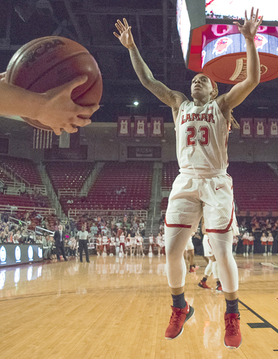 Moe Kinard, LU senior guard, attempts to block a throw during Lamar’s 62-46 victory against Stephen F. Austin StateUniversity, Saturday, in the Montagne Center. UP photo by Lakota Johnson