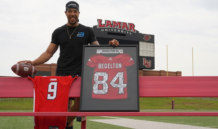 LU alumnus, Reggie Begelton, stands with his old Lamar University uniform and his new Calgary Stampeders jersey at Provost Umphrey Stadium, April 12. UP photo by Abigail Pennington