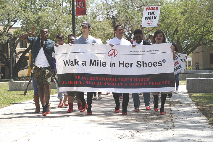 Students and faculty march across campus for LU’s annual “Walk a Mile in Her Shoes,” Tuesday. The march is part of the international men’s march that brings awareness to sexual assault, rape and gender violence. UP photo by Abigail Pennington